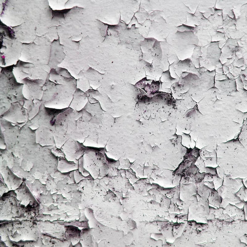 Close-up of a cracked white paint texture
