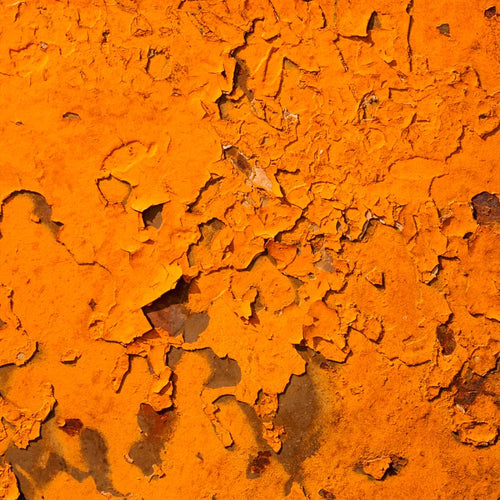 Vivid orange cracked paint texture