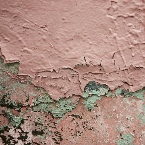 Peeling layers of paint on a wall