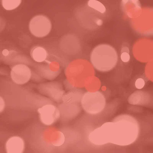 Abstract bokeh pattern in shades of pink and coral