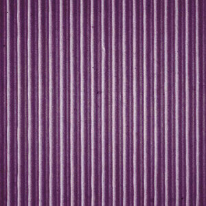 Textured purple corduroy fabric pattern
