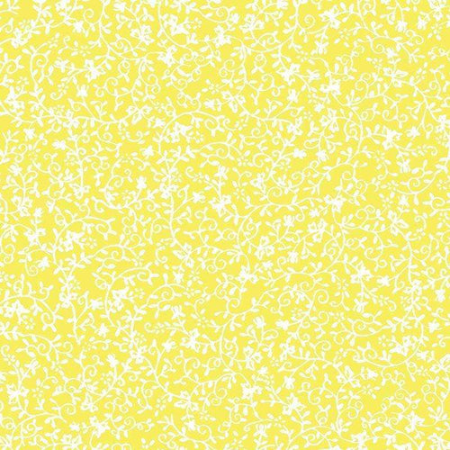 Intricate white floral pattern on a cheerful yellow background