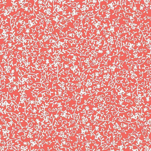 Intricate white floral pattern on a coral background