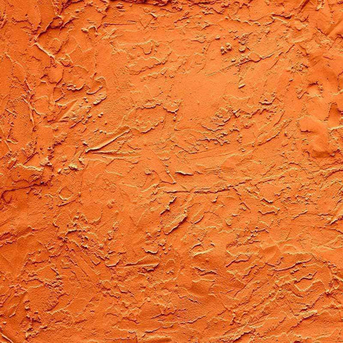 Vibrant orange textured pattern with dynamic and rugged surface