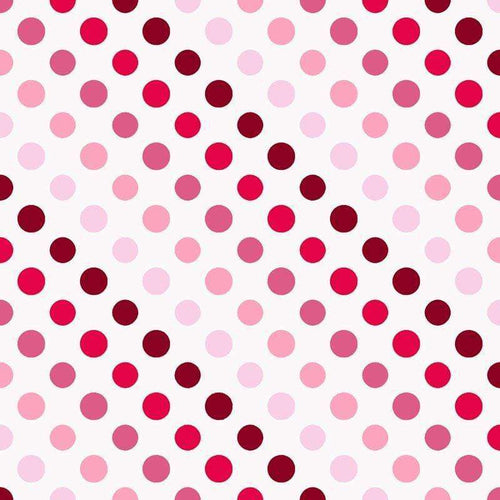 Assorted pink polka dots on white background
