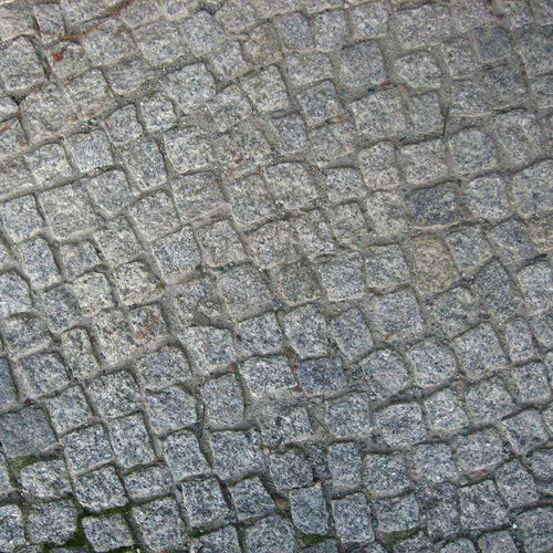 Old grey stone paved surface