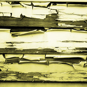 Textured pattern of peeling paint on wooden planks