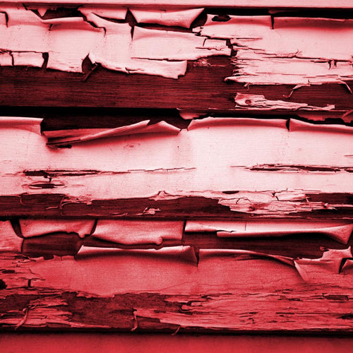 Textured red wooden boards with peeling paint