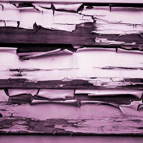 Textured pattern of peeling paint on wooden planks