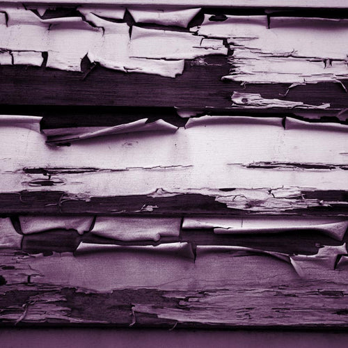 Weathered wooden texture with peeling paint effect in shades of purple