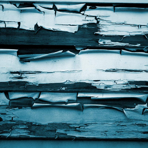 Close-up of peeling paint on wooden planks