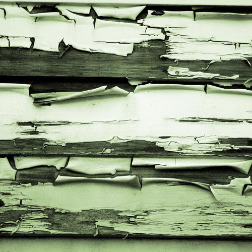 Old peeling green paint on wooden surface