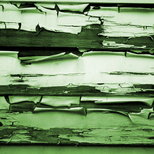Textured pattern of weathered green-painted wood
