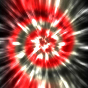 Blurry radial burst pattern in red, black, and white