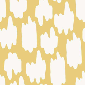 Abstract white splash shapes on a golden background