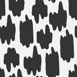 Abstract black ink blot shapes on white background