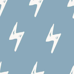 Abstract white lightning bolts on a pale blue background