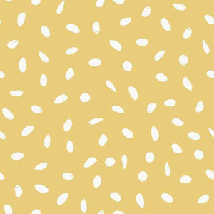 Abstract seed pattern on a warm mustard background