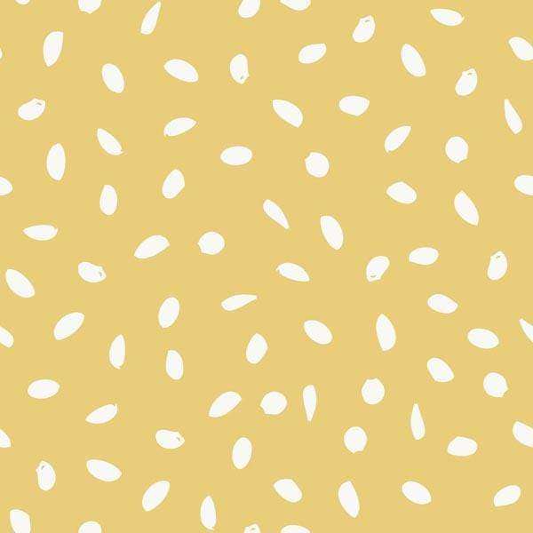 Abstract seed pattern on a warm mustard background