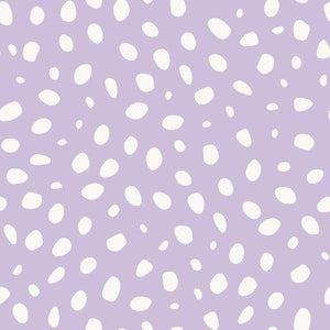 Scattered white speckles on a lavender background