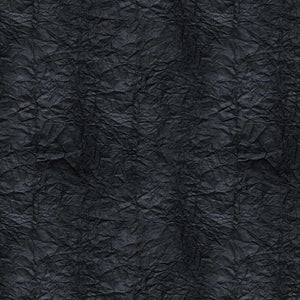 Crumpled paper texture in dark charcoal