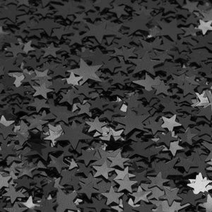 Scattered black and white star confetti pattern