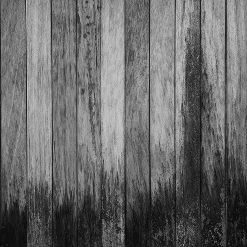 Black and white image of weathered wooden planks