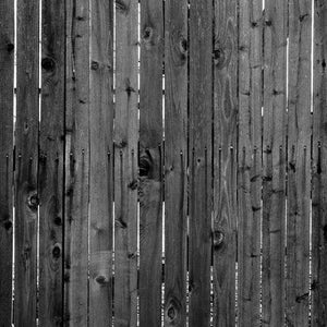 Black and white image of weathered wooden planks