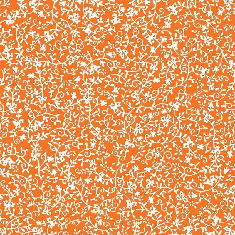 Intricate white floral pattern on a warm orange background