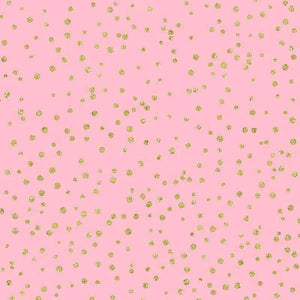 A pink background with scattered golden polka dots pattern