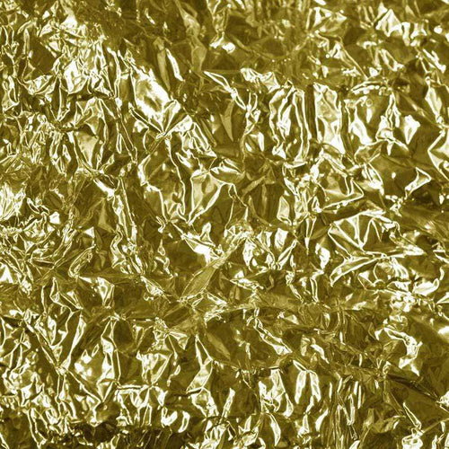 Abstract golden crumpled foil texture