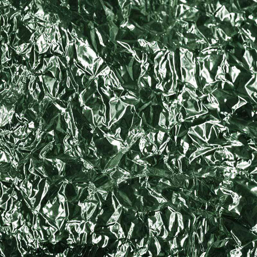 Crinkled foil texture with shiny emerald green tones