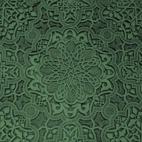 Intricate emerald green mandala pattern with a detailed symmetrical design