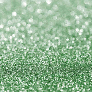 Glittering green textured surface representing a twinkling effect