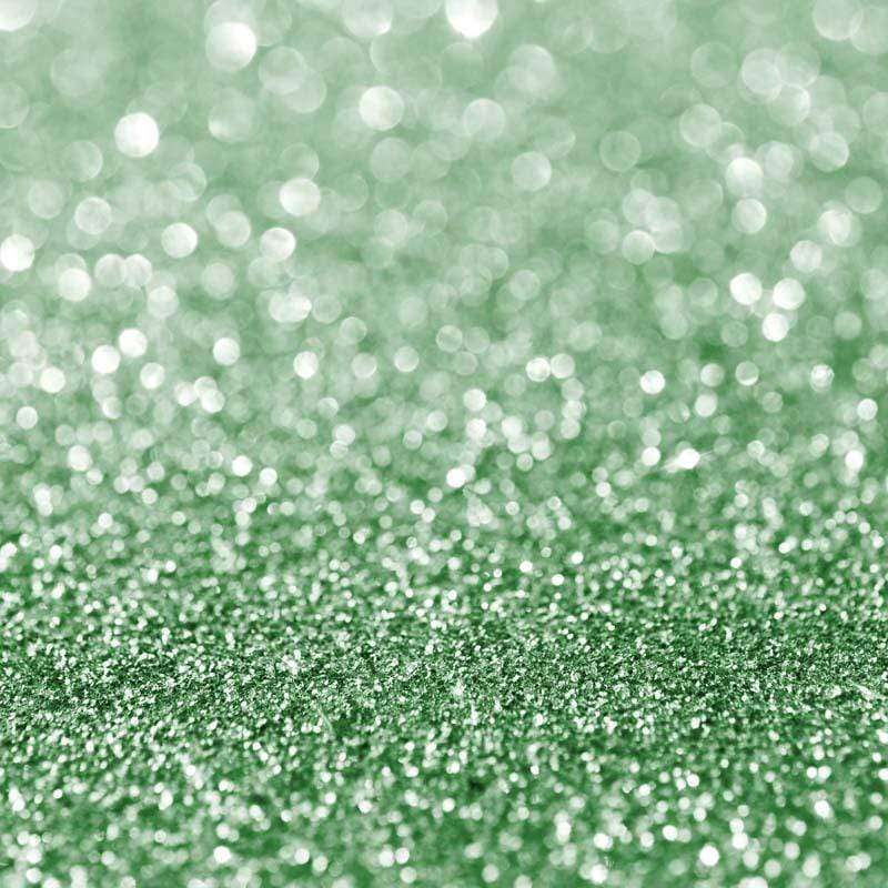 Glittering green textured surface representing a twinkling effect