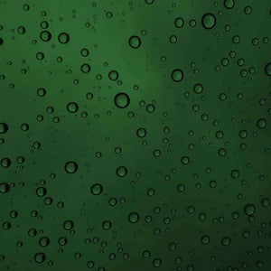 Green water droplets pattern on a window