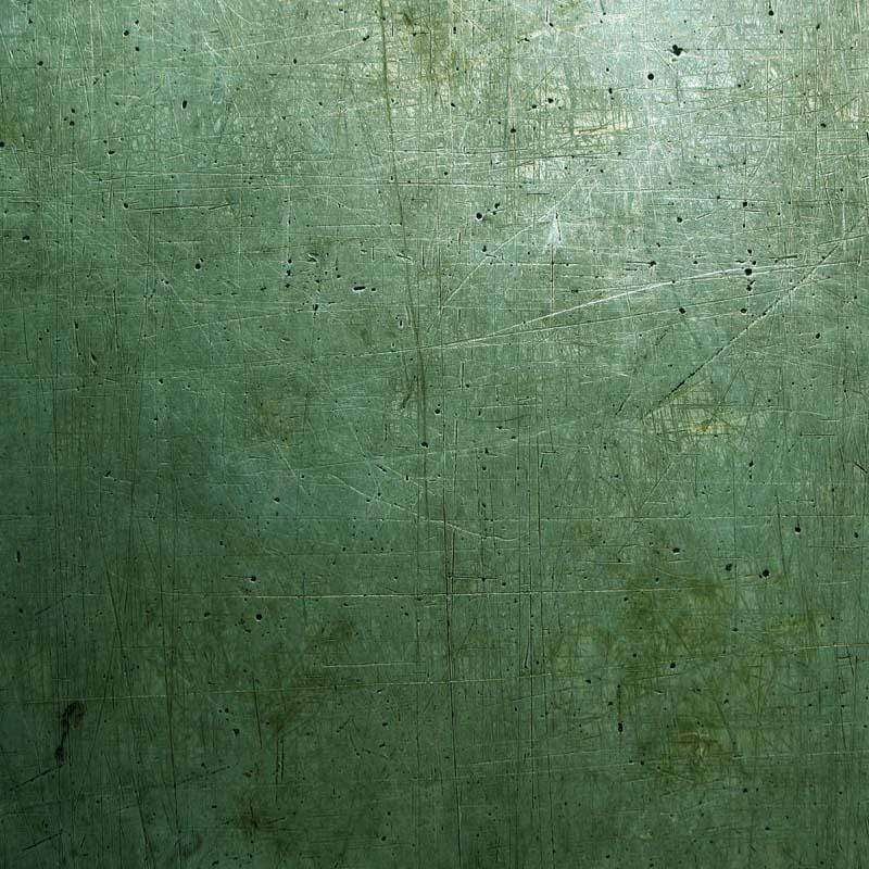 Aged green textured pattern with subtle markings and scratches