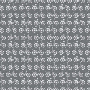 Seamless pattern of white vintage bicycles on a gray background