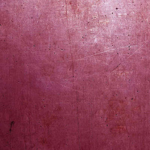 A textured pattern with scratches on a rose-colored background