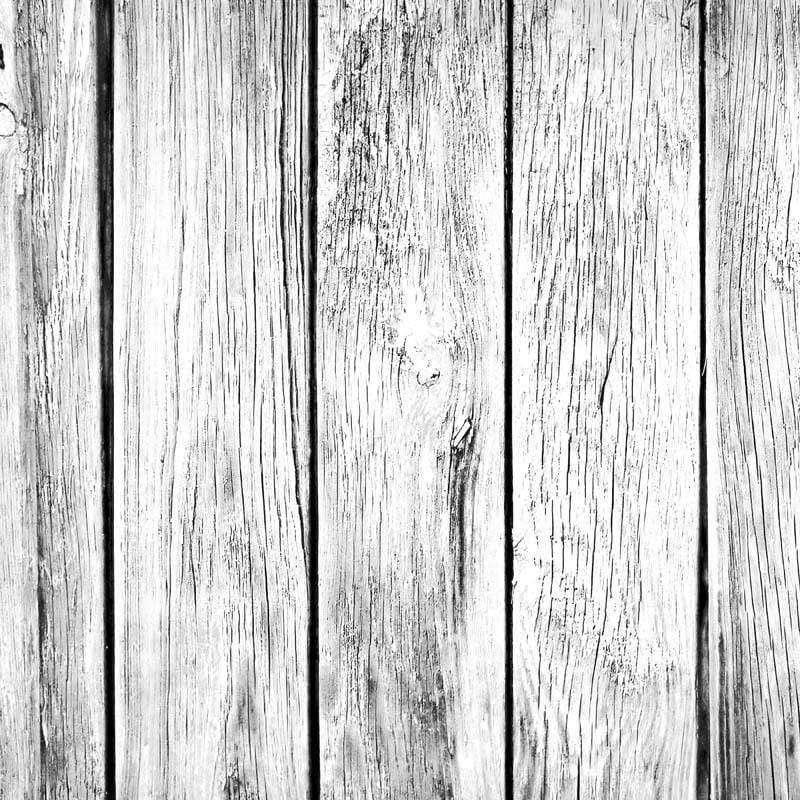 Black and white image of distressed wooden planks