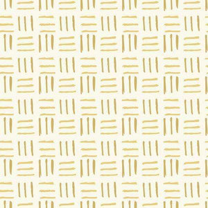 Abstract golden brush strokes pattern on a cream background
