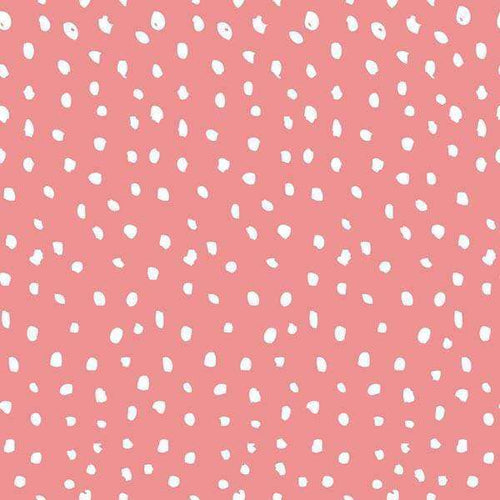 Scattered white dash pattern on a coral pink background