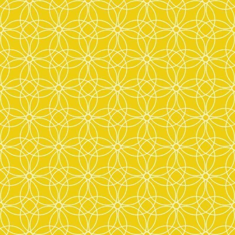 Intricate lace-like pattern on a warm yellow background