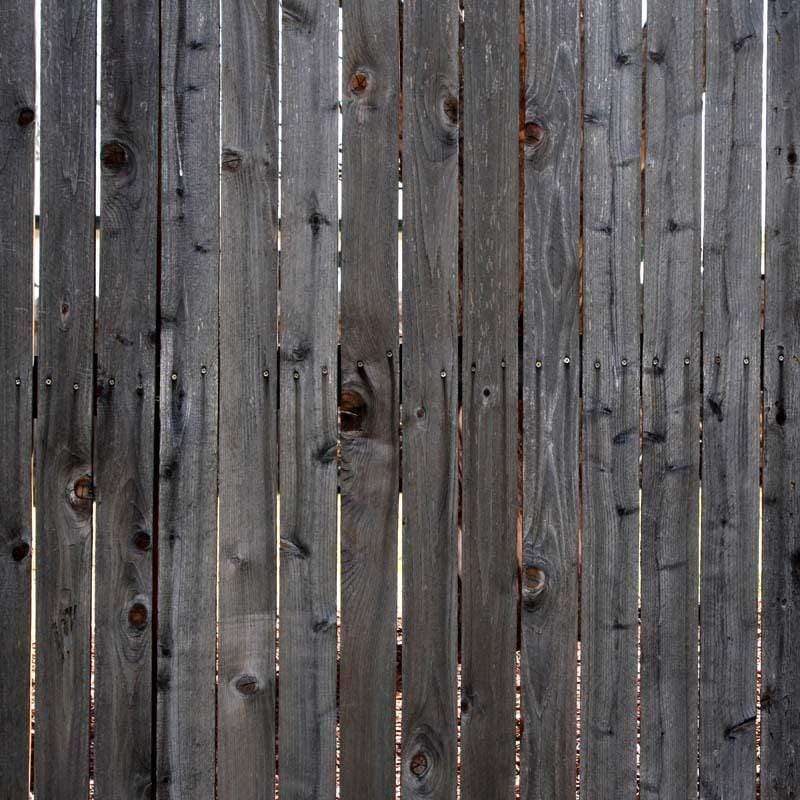 Vertical weathered wooden planks with natural tones