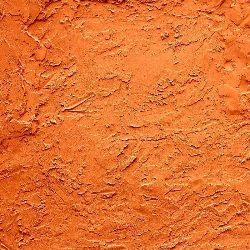Vibrant orange textured pattern with dynamic and rugged surface