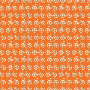 Seamless pattern of white bicycles on a burnt orange background