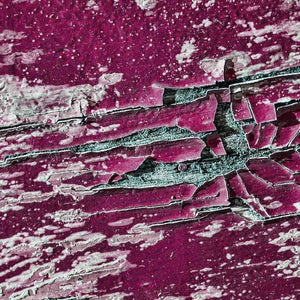 Textured deep pink cracked paint pattern