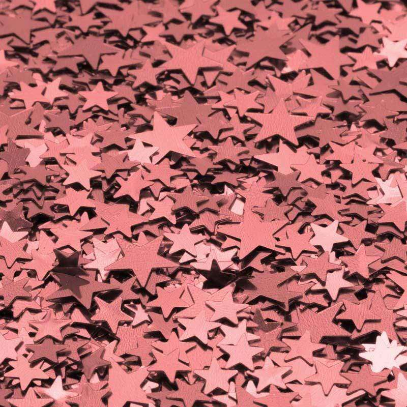 Scattered rose gold star confetti pattern