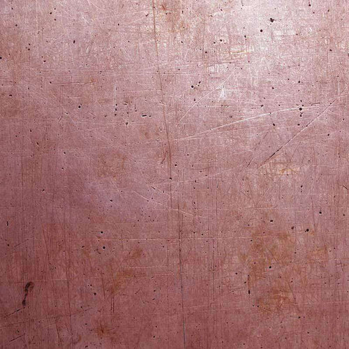 Aged pinkish-brown wood surface with scratches and scuffs