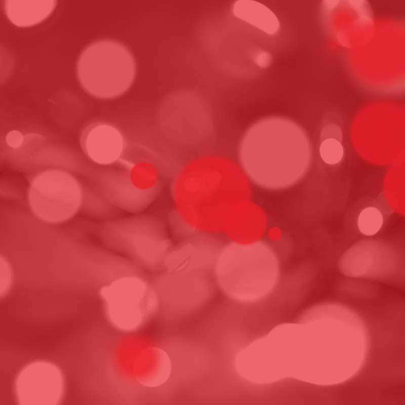 Abstract red bokeh pattern with blurred circles of light